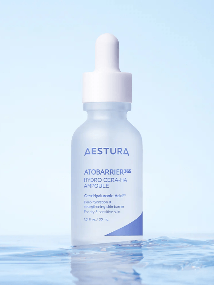 AESTURA Atobarrier 365 Hydro Cera-Ha Ampoule 200ml in a clear dropper bottle with a blue background.