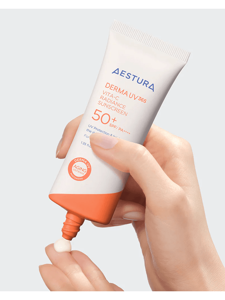 AESTURA Derma UV 365 Vita-C Radiance Sunscreen 40ml SPF50+ PA++++ being applied from the tube.