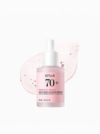 ANUA Peach 70 Niacin Serum 30ml in a dropper bottle with a pink background, showcasing hydration benefits.