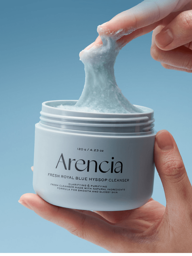 ARENCIA Blue Hyssop Rice Mochi Cleanser texture being pulled from container, designed for oily skin.