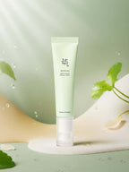 Beauty of Joseon Light On Serum: Centella + Vita C 30ml in a green tube with droplets on an elegant background.