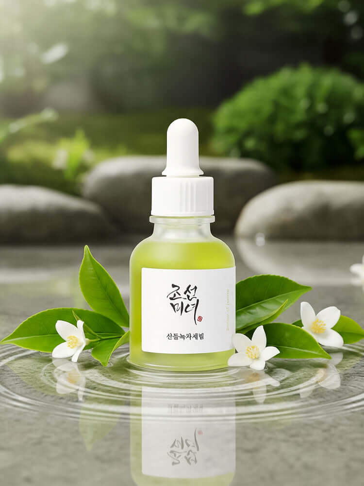 Beauty of Joseon Calming Serum in a glass bottle, surrounded by fresh green leaves and flowers, promoting hydration and calm.