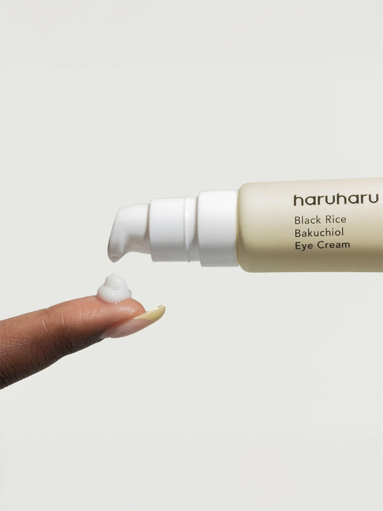 HARUHARU WONDER Black Rice Bakuchiol Eye Cream 20ml being dispensed onto a fingertip.