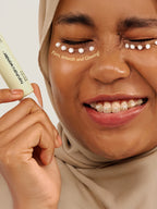 HARUHARU WONDER Black Rice Bakuchiol Eye Cream 20ml applied under eyes for firm, smooth, and glowing skin.