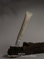 HARUHARU WONDER Black Rice Bakuchiol Eye Cream 20ml on a wooden surface with a minimalist design.