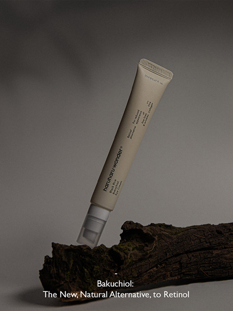 HARUHARU WONDER Black Rice Bakuchiol Eye Cream 20ml on a wooden surface with a minimalist design.