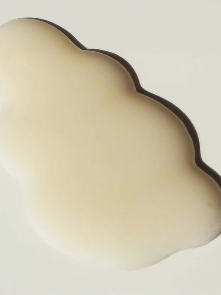 HARUHARU WONDER Black Rice Hyaluronic Anti-wrinkle Serum 50ml in a cloud-shaped container, showcasing its creamy texture.