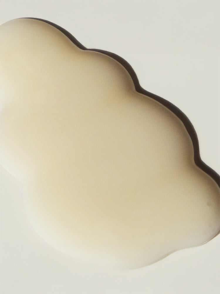 HARUHARU WONDER Black Rice Hyaluronic Anti-wrinkle Serum 50ml in a cloud-shaped container, showcasing its creamy texture.