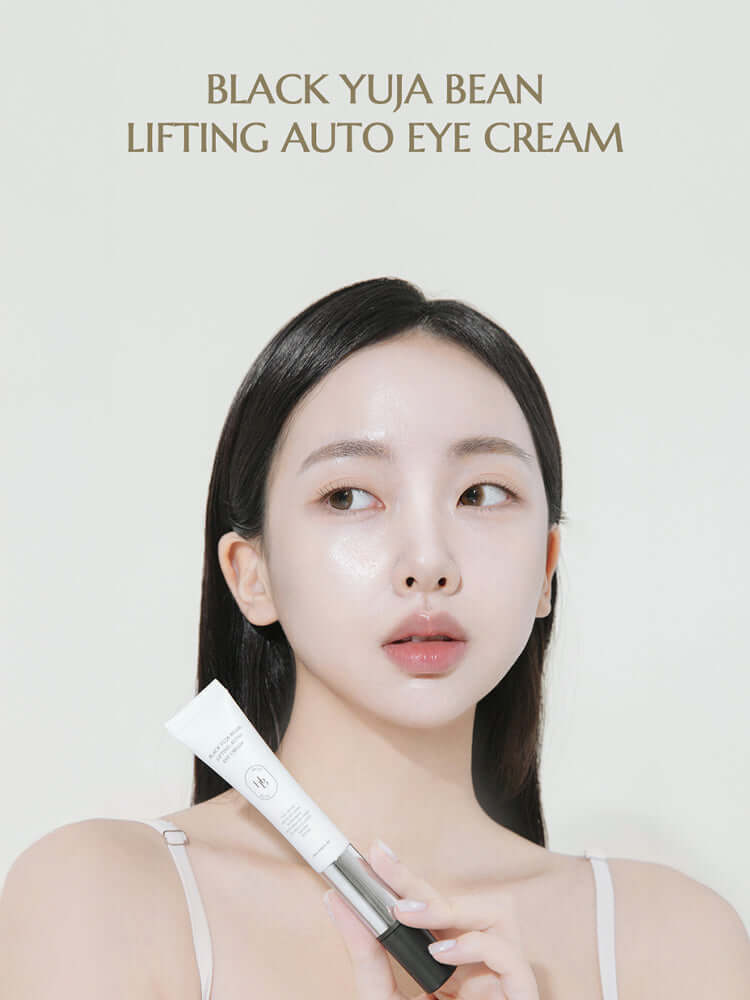 HEVEBLUE Black Yuja Bean Lifting Auto Eye Cream 15ml model applying eye cream
