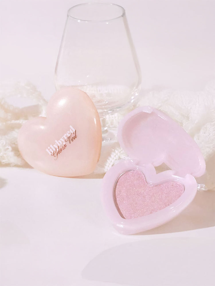 LILYBYRED [Pink Closet Edition] Luv Beam Glow Veil in heart-shaped compact, showcasing soft pink highlighter with radiant glow.