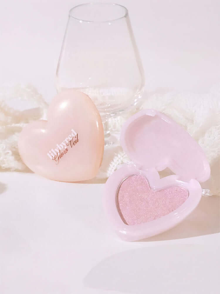 LILYBYRED [Pink Closet Edition] Luv Beam Glow Veil in heart-shaped compact, showcasing soft pink highlighter with radiant glow.