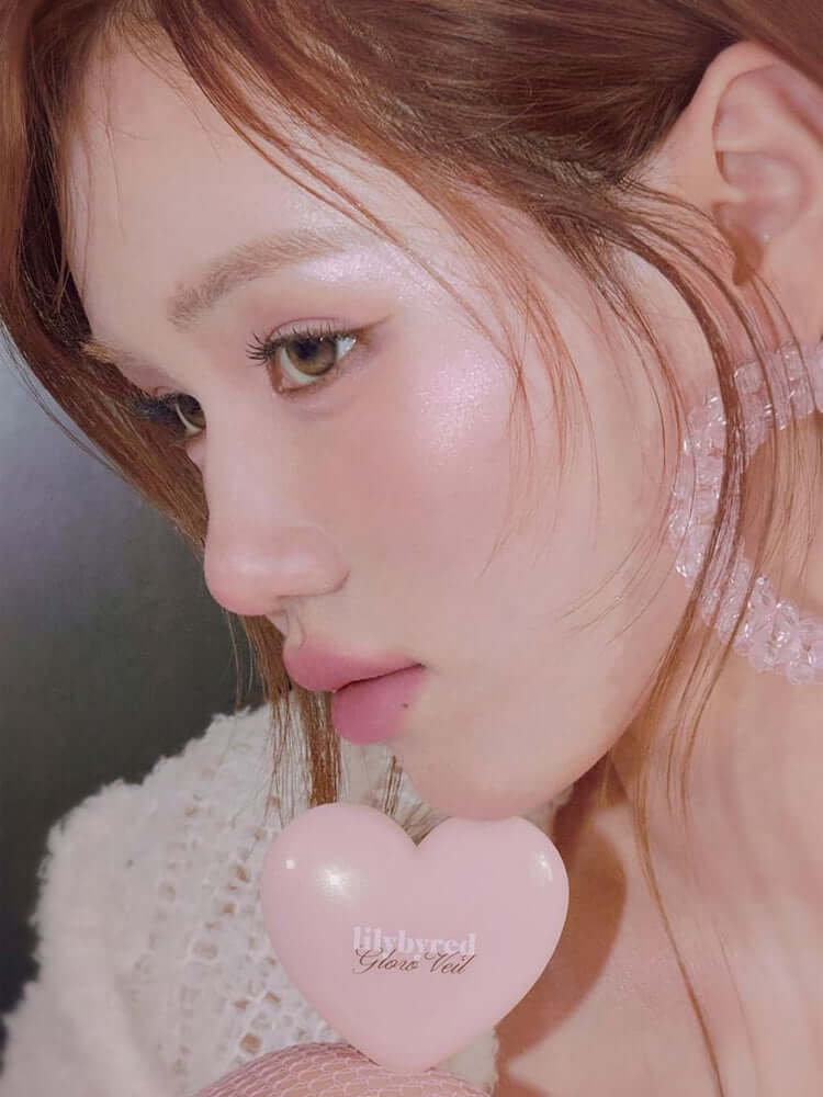 LILYBYRED [Pink Closet Edition] Luv Beam Glow Veil showcased on model with shimmering skin and heart-shaped compact.