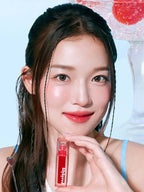 A model showcasing LILYBYRED Juicy Liar Water Tint 4.8g with a fresh and vibrant look.