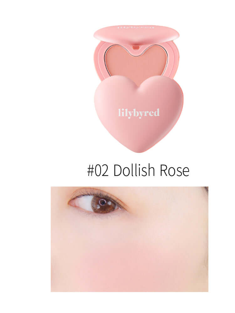LILYBYRED Luv Beam Cheek 4.7g packaging with heart shape and swatch showing #02 Dollish Rose blush effect on skin.