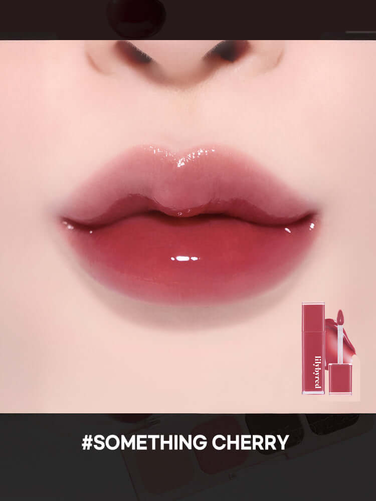 LILYBYRED Cherry Bell lip color with a glossy cherry sheen, showcasing soft cherry tones on model's lips.