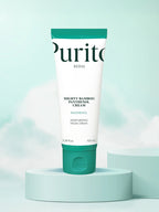 PURITO Mighty Bamboo Panthenol Cream 100ml in a green and white tube against a soft blue background.