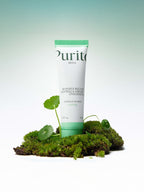 PURITO Wonder Releaf Centella Cream Unscented 50ml on moss with green plants, offering soothing skincare benefits.