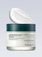 PYUNKANG YUL Calming Moisture Barrier Cream 50ml in a jar with cream being poured out, perfect for soothing irritated skin.