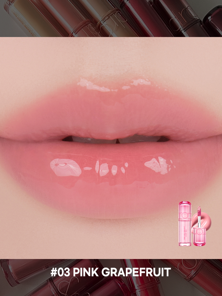 Romand juicy lasting tint applied on lips in #03 Pink Grapefruit shade, showcasing the glossy finish and color.