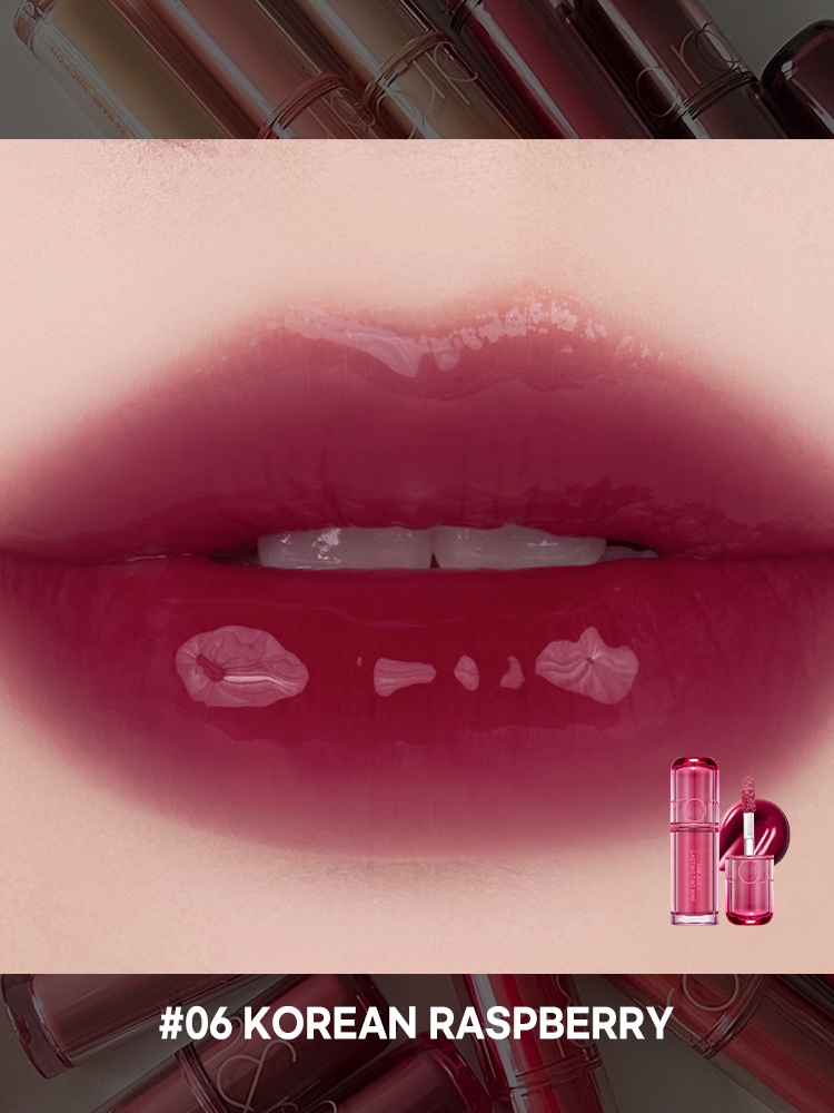 romand juicy lasting tint in Korean Raspberry shade swatched on lips, showcasing glossy finish.