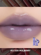romand juicy lasting tint in #12 Odd Mulberry, featuring a glossy, transparent finish on lips.