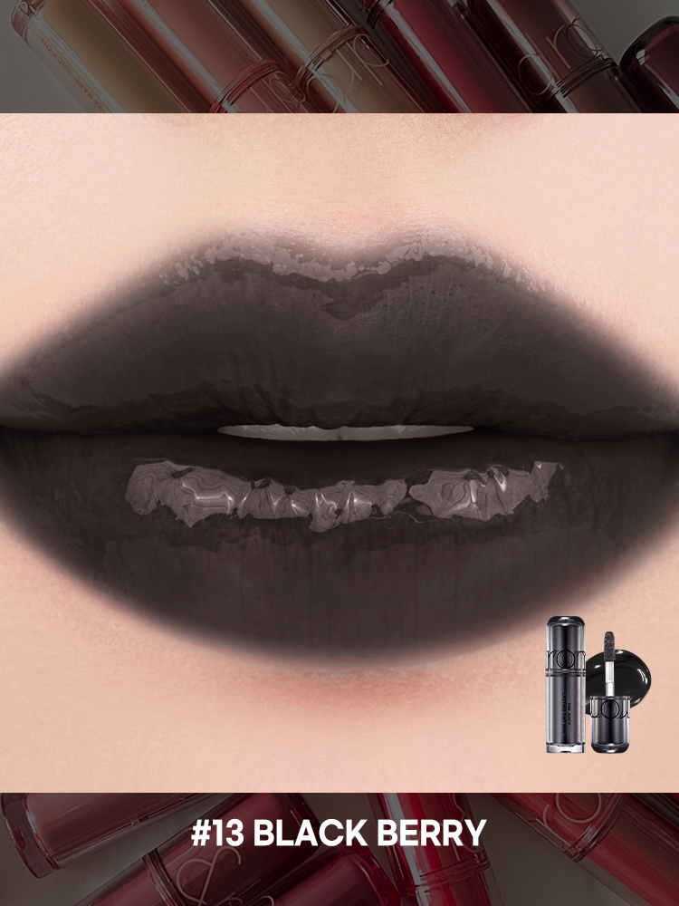 romand juicy lasting tint in #13 Black Berry, showcasing a glossy, dark lip color against a colorful background.