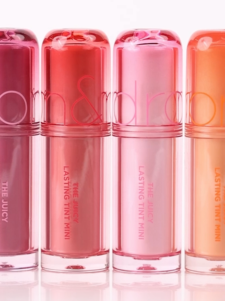 romand juicy lasting tint in mini bottles showcasing a variety of vibrant fruit-inspired colors.
