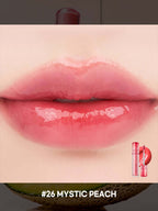 rom&nd The Juicy Lasting Tint 2.0 3.5g #26 MYSTIC PEACH applied on glossy lips with a shiny finish.