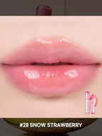 Close-up of glossy lips wearing rom&nd The Juicy Lasting Tint 2.0 3.5g #RareSeries in shade #28 Snow Strawberry.