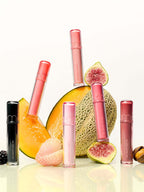 rom&nd The Juicy Lasting Tint 2.0 3.5g displayed with exotic fruits against a light background.