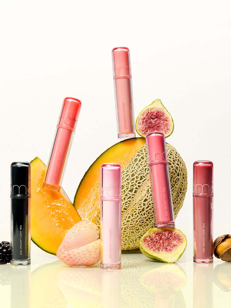 rom&nd The Juicy Lasting Tint 2.0 3.5g displayed with exotic fruits against a light background.