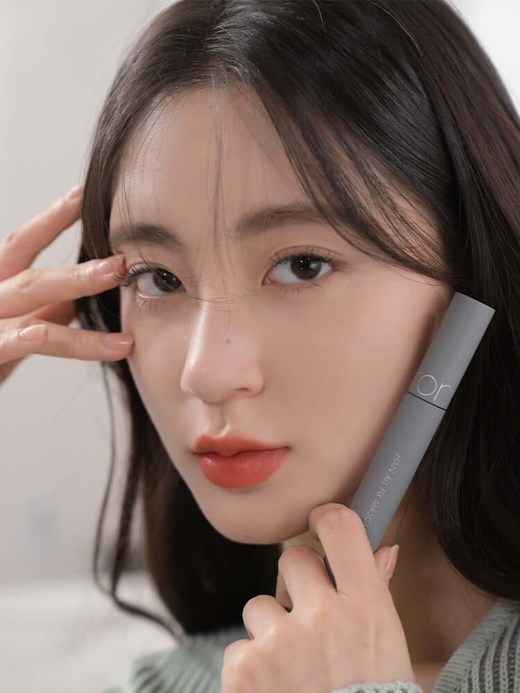 Model showcasing rom&nd Han All Fix Mascara, a top choice in korean beauty products online nz.