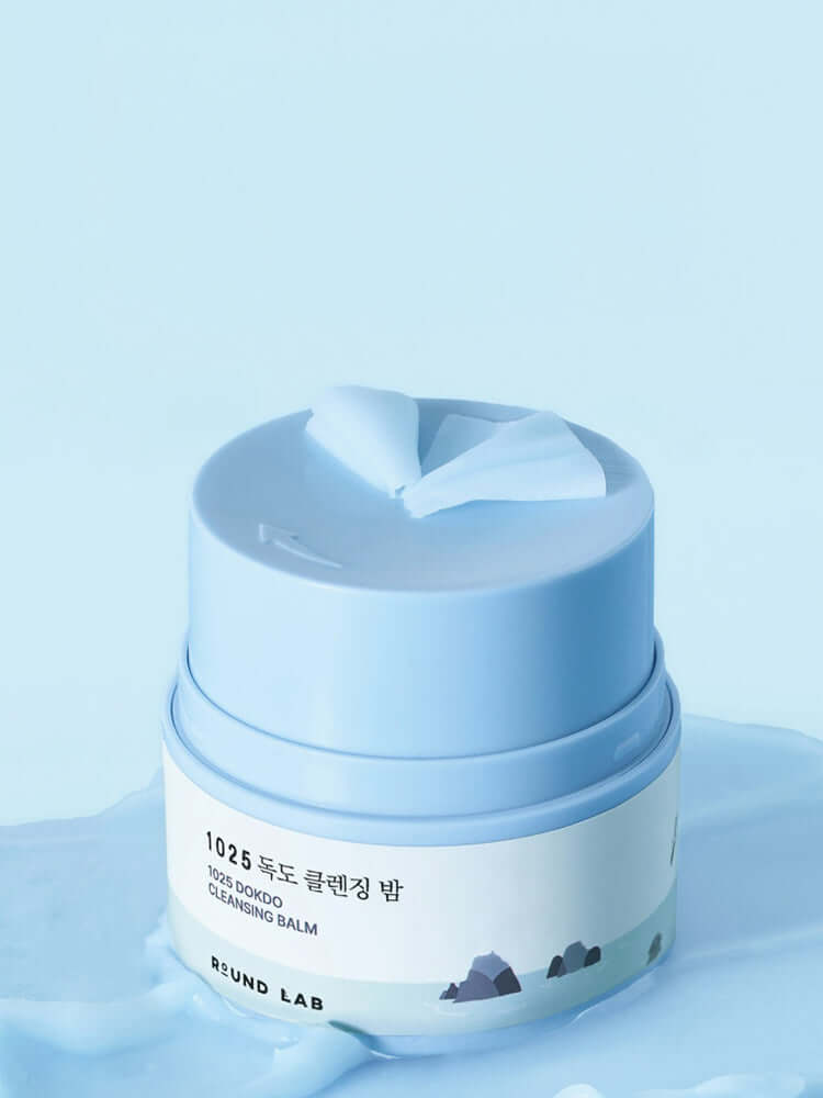 ROUND LAB 1025 Dokdo Cleansing Balm 100ml in a blue jar with a smooth texture.
