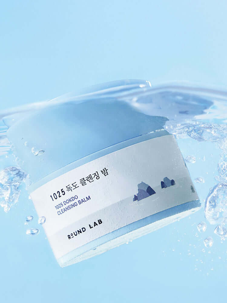 ROUND LAB 1025 Dokdo Cleansing Balm 100ml in water, showcasing hydrating and deep cleansing properties.