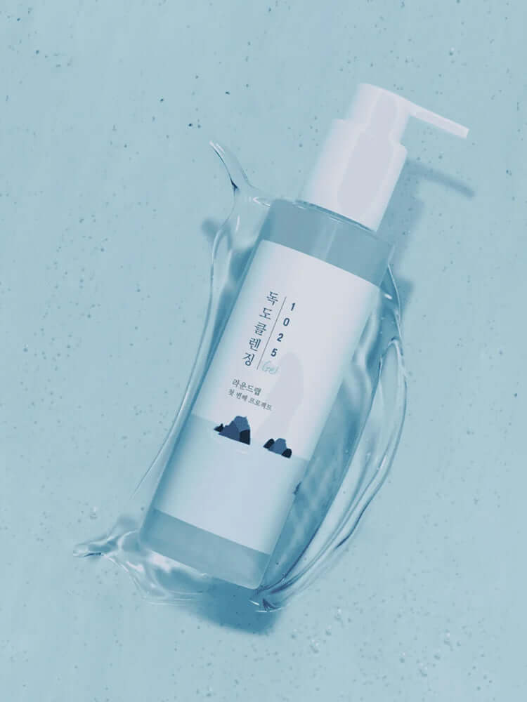 ROUND LAB 1025 Dokdo Cleansing Gel 150ml in a splash of water, showcasing its refreshing formula.