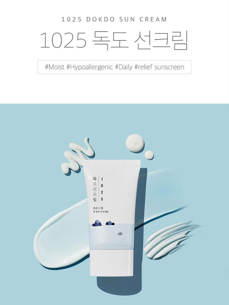 ROUND LAB 1025 Dokdo Sunscreen packaging displayed with creamy texture on a blue background.