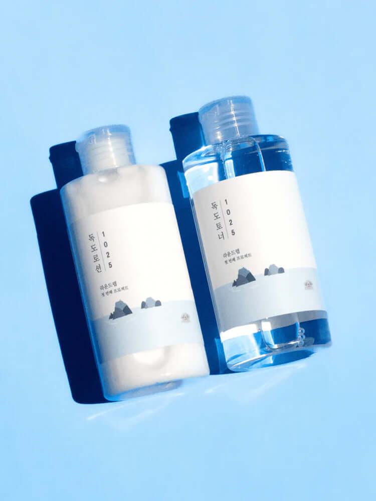 ROUND LAB 1025 Dokdo Toner Lotion Special Set (Toner 200ml+Lotion 200ml) displayed on a blue background.