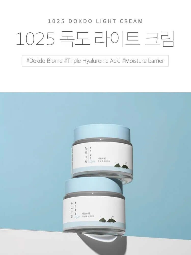ROUND LAB 1025 Dokdo Light Cream 80ml displayed against a light blue background, showcasing its hydrating properties.