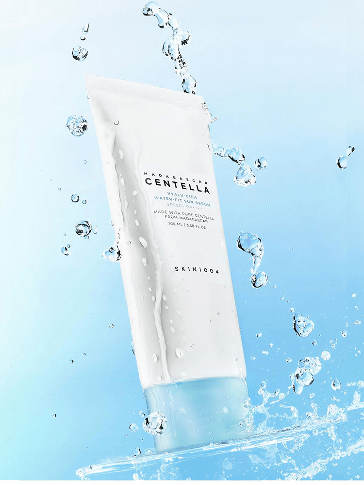 SKIN1004 Madagascar Centella Hyalu-Cica Water-Fit Sun Serum packaging with water droplets for UV protection.
