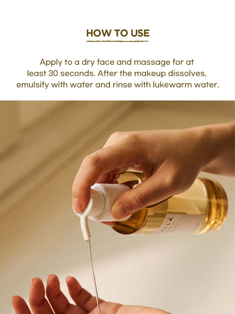 Person using SKIN1004 Madagascar Centella Light Cleansing Oil 200ml for cleansing skin.