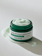 SOME BY MI AHA-BHA-PHA 30Days Miracle Cream 60g in a green jar with a smooth cream texture.
