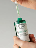 SOME BY MI AHA-BHA-PHA 30 Days Miracle Serum 50ml in dropper being applied for balanced skin care.