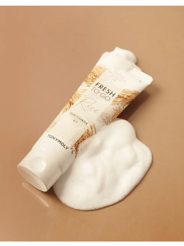 TONY MOLY Fresh To Go Foam Cleanser in Rice variant with creamy foam on a beige background.