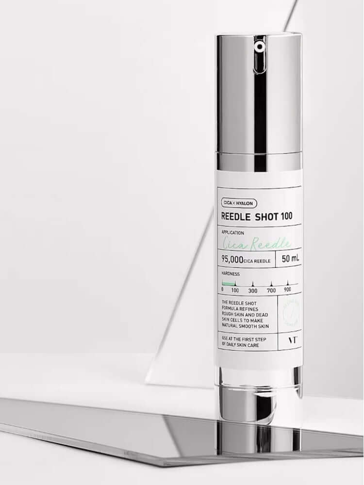 VT Reedle Shot 100 50ml on a reflective surface, showcasing its CICA pre-care skin treatment.