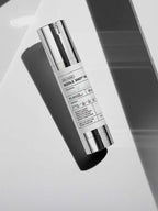 VT Reedle Shot 100 50ml - skincare product in a sleek bottle on a reflective surface